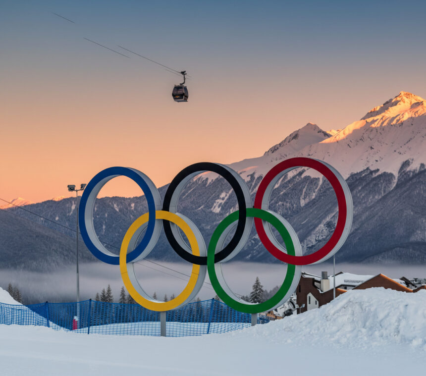 Winter Olympics stadium decorated with Olympic rings during competition